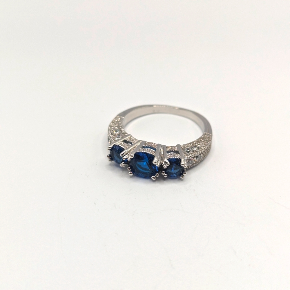 Size 9.25 silver ring with blue stones